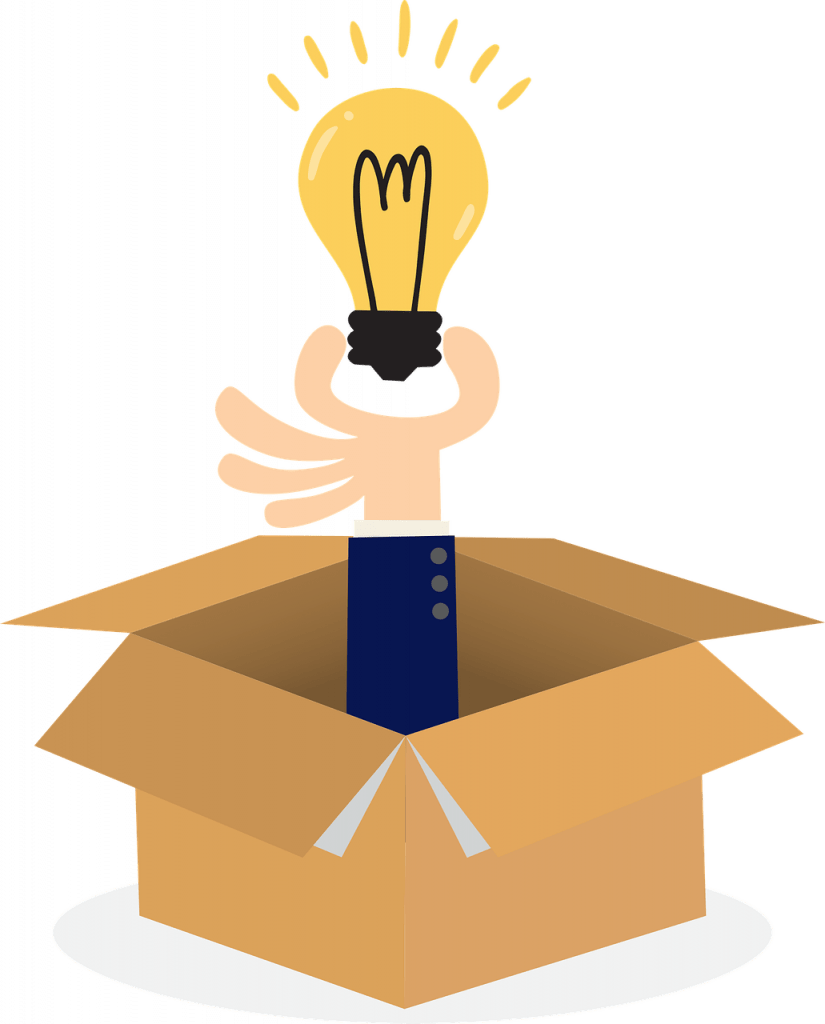 a box with a hand holding a lightbulb